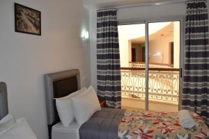 Postel nebo postele na pokoji v ubytování Hotel La Place