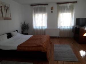 En eller flere senge i et værelse på Casa Vintage 27