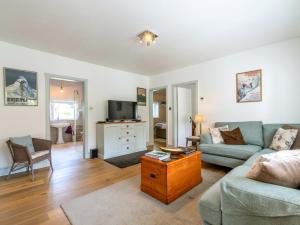 a living room with a couch and a table at 3 bed property in Stonegate Sussex 57396 in Ticehurst