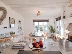 a kitchen with a table with a plate of fruit on it at 4 bed property in Richmond 77835 in Richmond