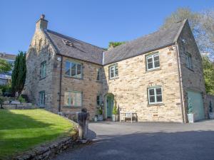 a stone house with a statue in front of it at 4 bed property in Richmond 77835 in Richmond