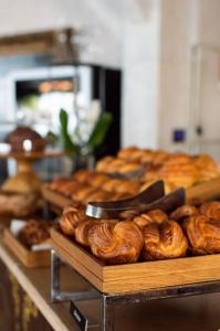 a bunch of pastries on display in a bakery at La Chèvre d'Or in Éze