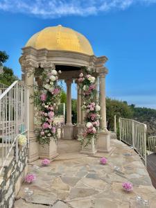 a gazebo with flowers on it at La Chèvre d'Or in Éze