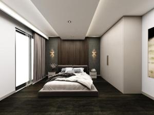 Un pat sau paturi într-o cameră la CKHOTEL