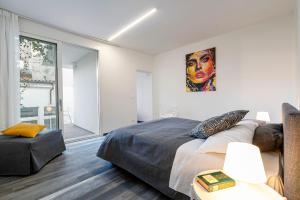 Säng eller sängar i ett rum på Palazzo Ruzante Padova - Barcellona Apt