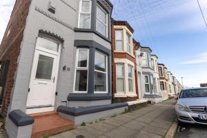 a row of houses on a city street at Host Liverpool - Anfield Gem, pet-friendly with garden in Liverpool