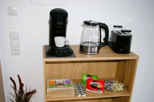 a shelf with a blender and a coffee maker on it at Sellraintaler Auszeit 2 in Sellrain