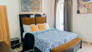 A bed or beds in a room at VI/Ikoyi/Oniru Lagos Property