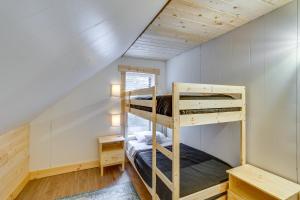 a bedroom with two bunk beds in a house at Avery Creek Cabins Hike, Bike, Fish and More! 