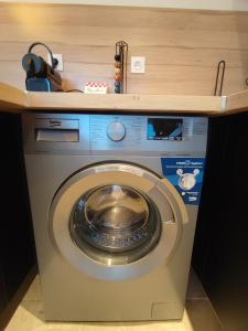 a washing machine with a counter on top of it at L'Ipanema - Standing T2 + Balcon in Cassis