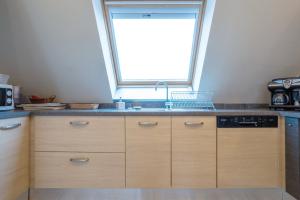 Kuchyň nebo kuchyňský kout v ubytování Appartement 100m2 Vilvic vue mer