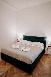 Ліжко або ліжка в номері Suite Maxxi Roma
