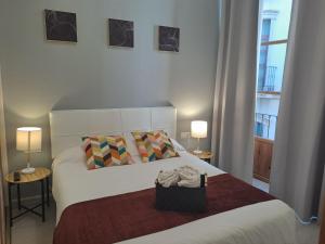 Postel nebo postele na pokoji v ubytování Nest Style Granada