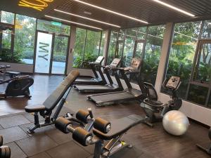a gym with a bunch of exercise equipment in a room at Qsara Home Gamuda Garden in Rawang