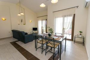 a living room with a table and a couch at Villa Oliva in Astris