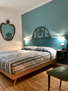 Postel nebo postele na pokoji v ubytování DIMOR'A' ROOMS