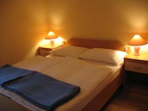 Säng eller sängar i ett rum på Apartments Timjana
