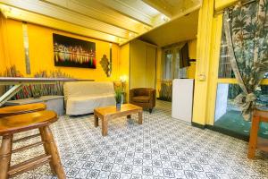 a living room with a bed and a table at #M1 La maisonnette des 3 ponts Terrace in Saint-Égrève