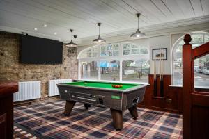 a billiard room with a pool table in it at Elephant and Castle in Wakefield