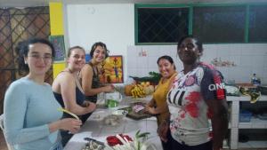 a group of people standing in a kitchen at Itapoa Reserve in Puerto Quito