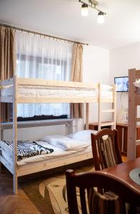 Postel nebo postele na pokoji v ubytování Hostel Wielka Krokiew