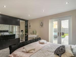 a bedroom with a large bed with pillows on it at 2 bed property in Howden 86817 in Scalby