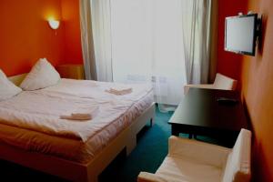 Postel nebo postele na pokoji v ubytování Hotelové Pokoje Kolčavka