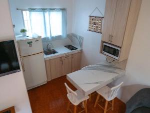 Virtuvė arba virtuvėlė apgyvendinimo įstaigoje Las Casitas en Salinas