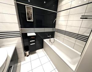Kúpeľňa v ubytovaní Apartament Włodarzewska