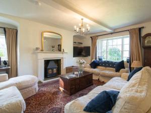 a living room with a couch and a fireplace at 4 bed in Kings Lynn 78123 in Downham Market
