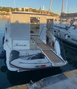 a boat is docked in the water with a dock at Miamoryacht in Nydri