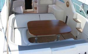 a table and chair in the back of a boat at Miamoryacht in Nydri