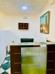 an office with a desk and a chair in a room at Nouadhibou Guest House in Nouadhibou