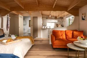 a living room with a couch and a table at Copperbeech - Luxury Holiday with Private Hottub in Blandford Forum