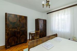 Postel nebo postele na pokoji v ubytování Apartment Pavo