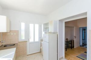 Kuchyň nebo kuchyňský kout v ubytování Apartment Pavo