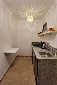a kitchen with a sink and a counter top at Riad Naya in Marrakech