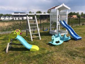 a playground with a slide at New holiday homes near the sea in Niechorze in Niechorze