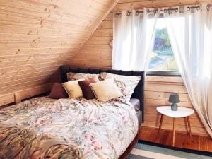 Voodi või voodid majutusasutuse New holiday homes near the sea in Niechorze toas