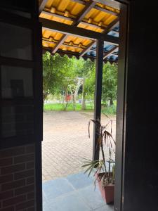 an open door to a patio with a playground at Pesque pague pousada do Carlinho in Pinheiral