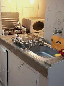 a kitchen counter with a sink in a kitchen at Mi mini estudio 2 in Rabat