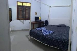 เตียงในห้องที่ Casa com piscina na praia de Boiçucanga