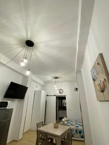 a living room with a table and a ceiling at Casa Chiaretta in Palermo