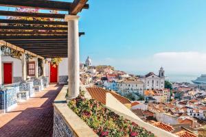 a view of a city from a balcony at São Vicente @ Heart of Alfama in Lisbon