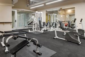 a gym with several treadmills and cardio machines at Hotel Monterrey Macroplaza in Monterrey