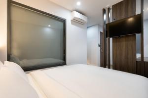 Postel nebo postele na pokoji v ubytování CÁT ANH HOTEL