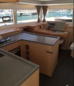 a kitchen with a counter top in a boat at Catamaran mia in Nydri