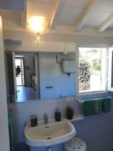a bathroom with a sink and a mirror at Torre del Campese in Campese