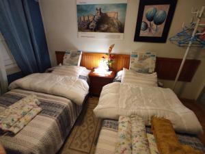 A bed or beds in a room at Casa Terzia a 10 min de Logroño