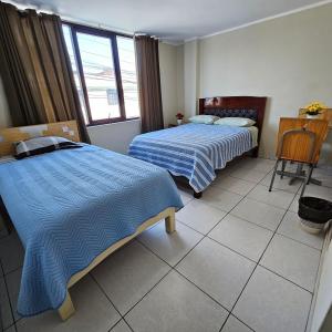 A bed or beds in a room at Hostal Santa Barbara